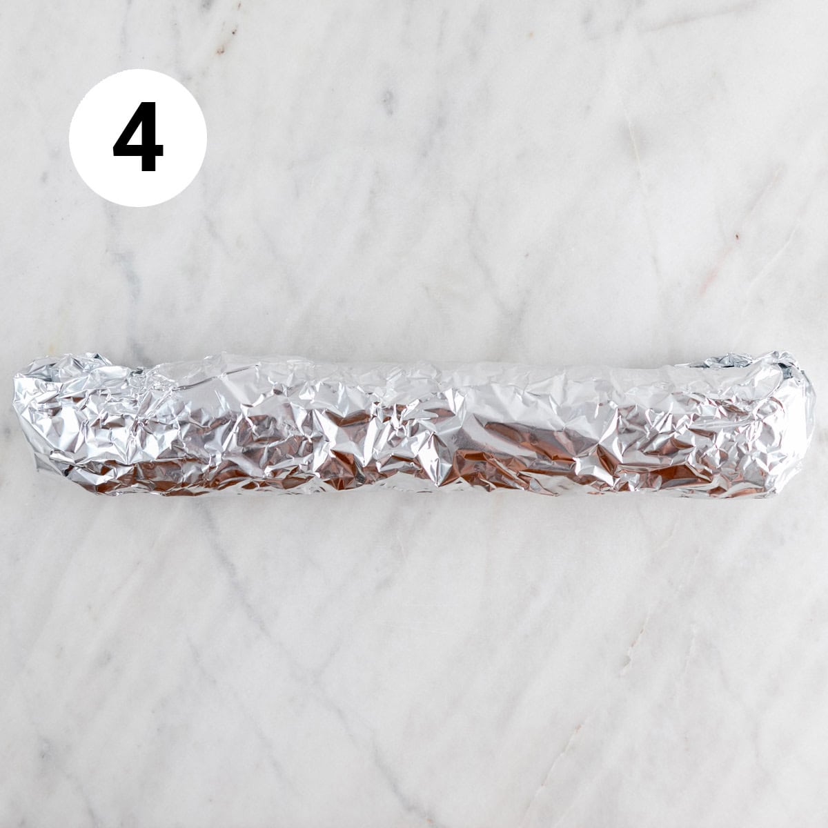 Baguette wrapped with foil.