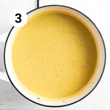 Blended vegan potato leek soup in a large pot.