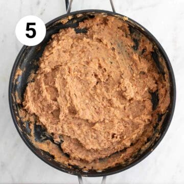 Mashed vegan refried beans in a pan.