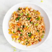 Vegan fried rice in shallow serving dish.