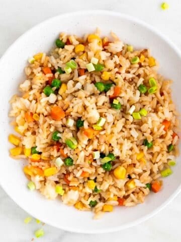 Vegan fried rice in shallow serving dish.