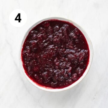 Cooked vegan cranberry sauce in a bowl after cooling and thickening.