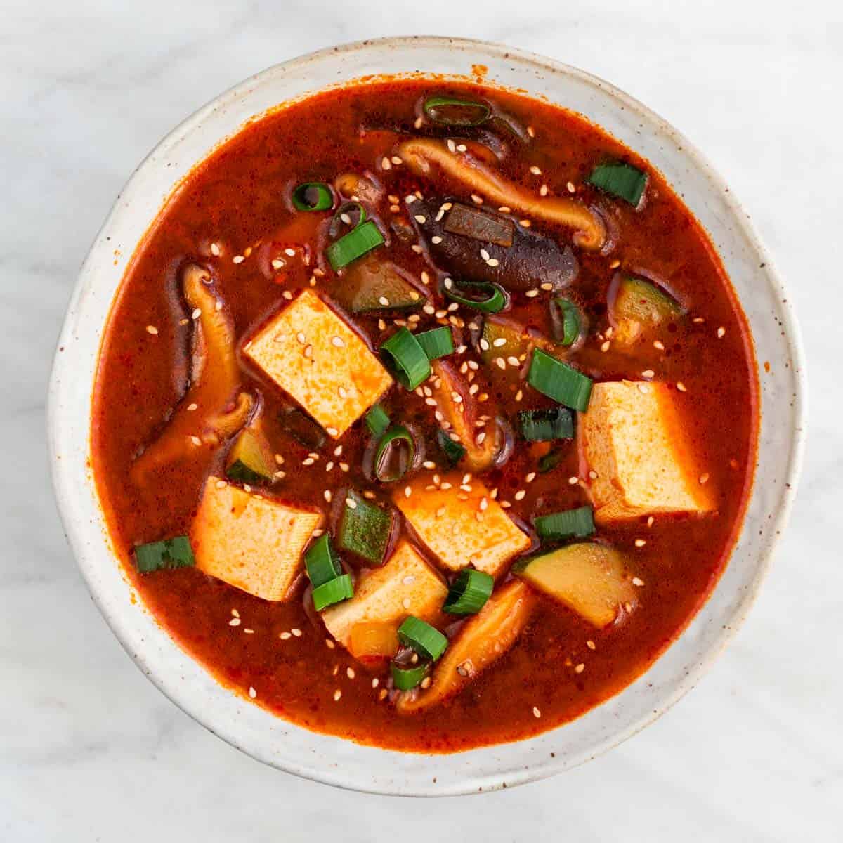 Spicy Korean tofu soup served in a bowl.
