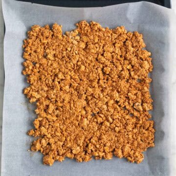 Tofu ground beef in a baking sheet before baking.