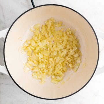 Sautéed garlic and onion in a large pot.
