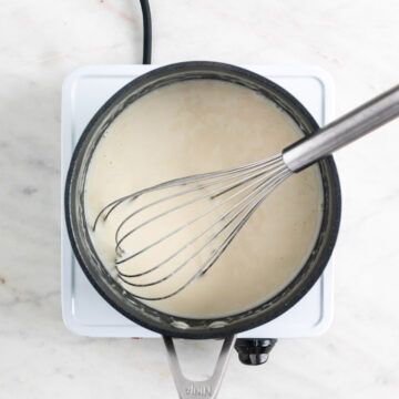 Cooked vegan panna cotta mixture in a saucepan.