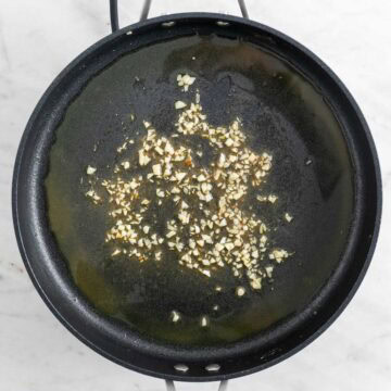 Garlic sautéed in a skillet.