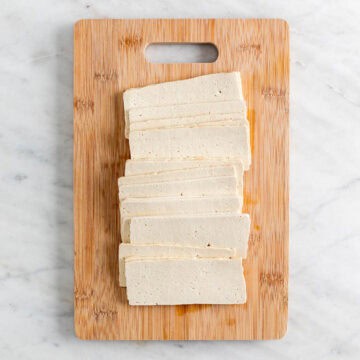 Sliced tofu on a cutting board.