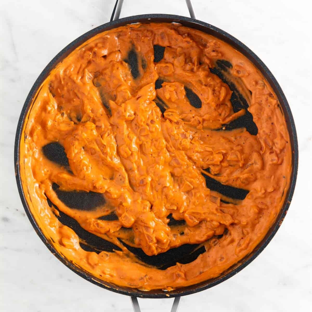 Vegan pasta sauce in a skillet before adding the basil.