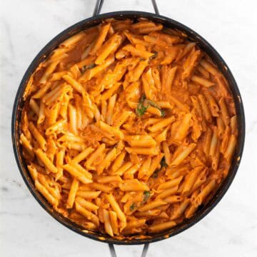 Vegan pasta sauce in a skillet with penne.