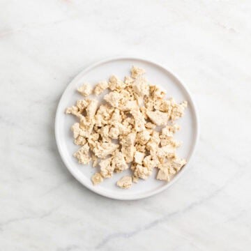 Tofu crumbles on a plate.