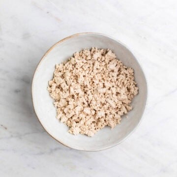 Crumbled tofu in a large bowl.