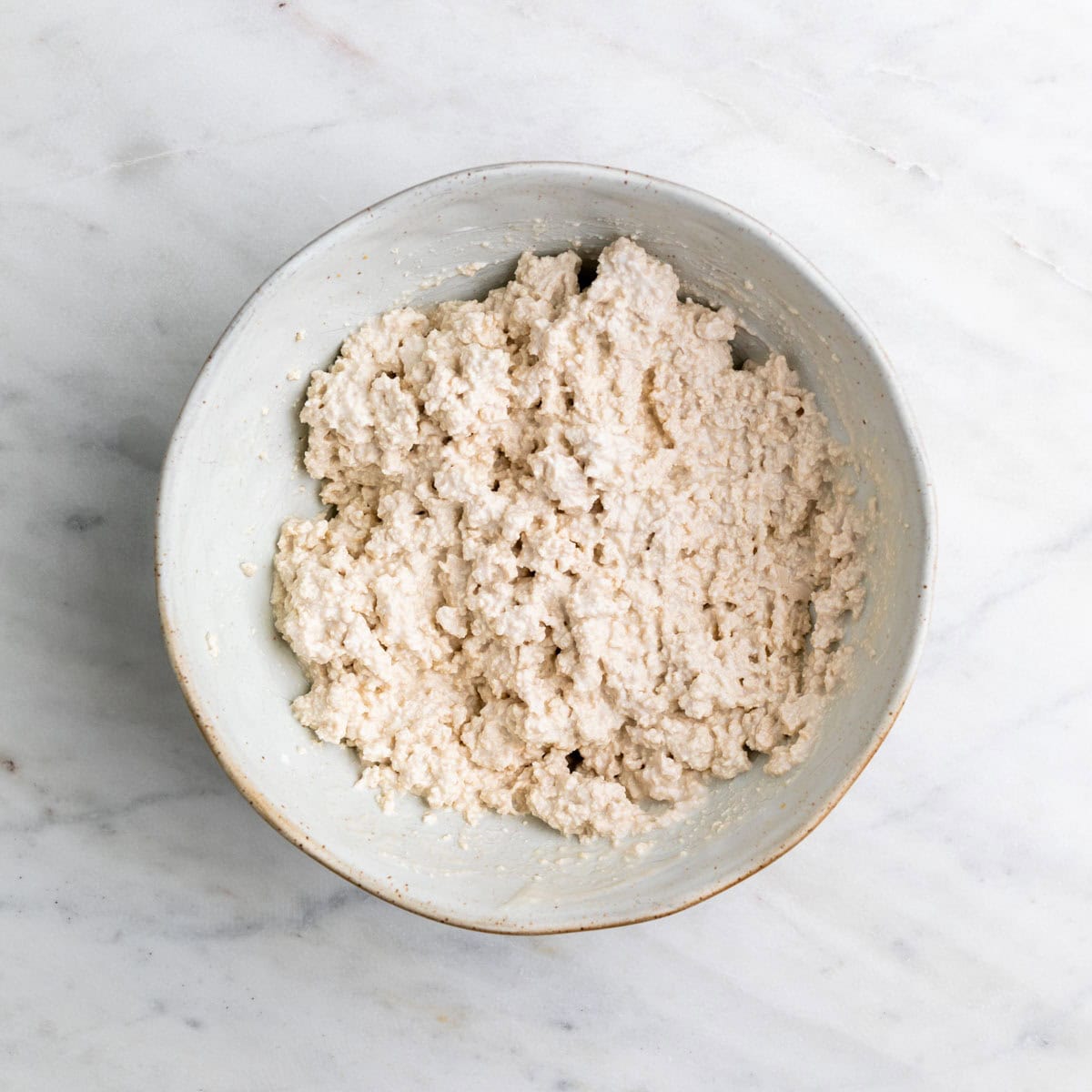 Vegan cottage cheese in a large bowl.