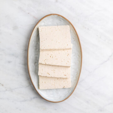 Tofu pieces on a plate.