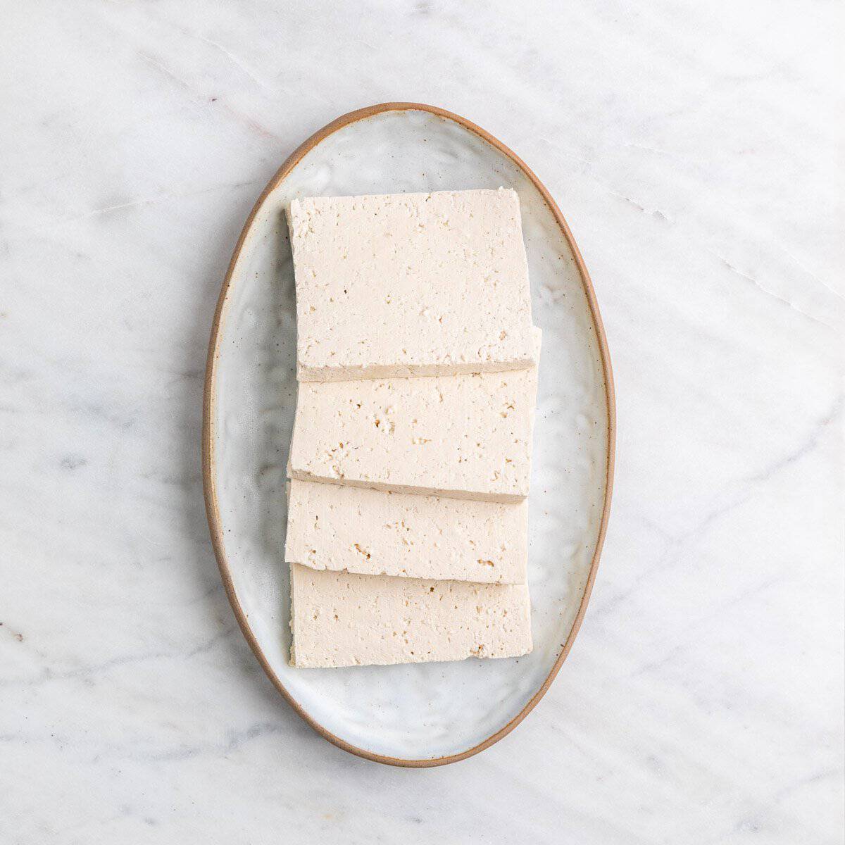 Tofu pieces on a plate.