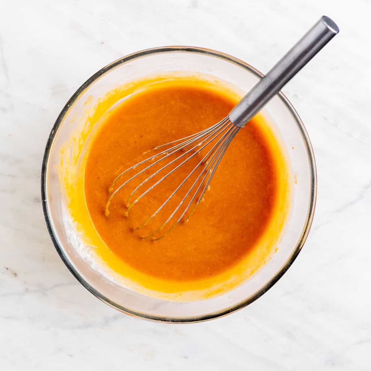 Wet ingredients mixed in a bowl.