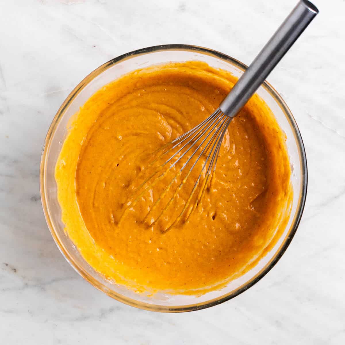 Vegan pumpkin cake batter in a bowl.
