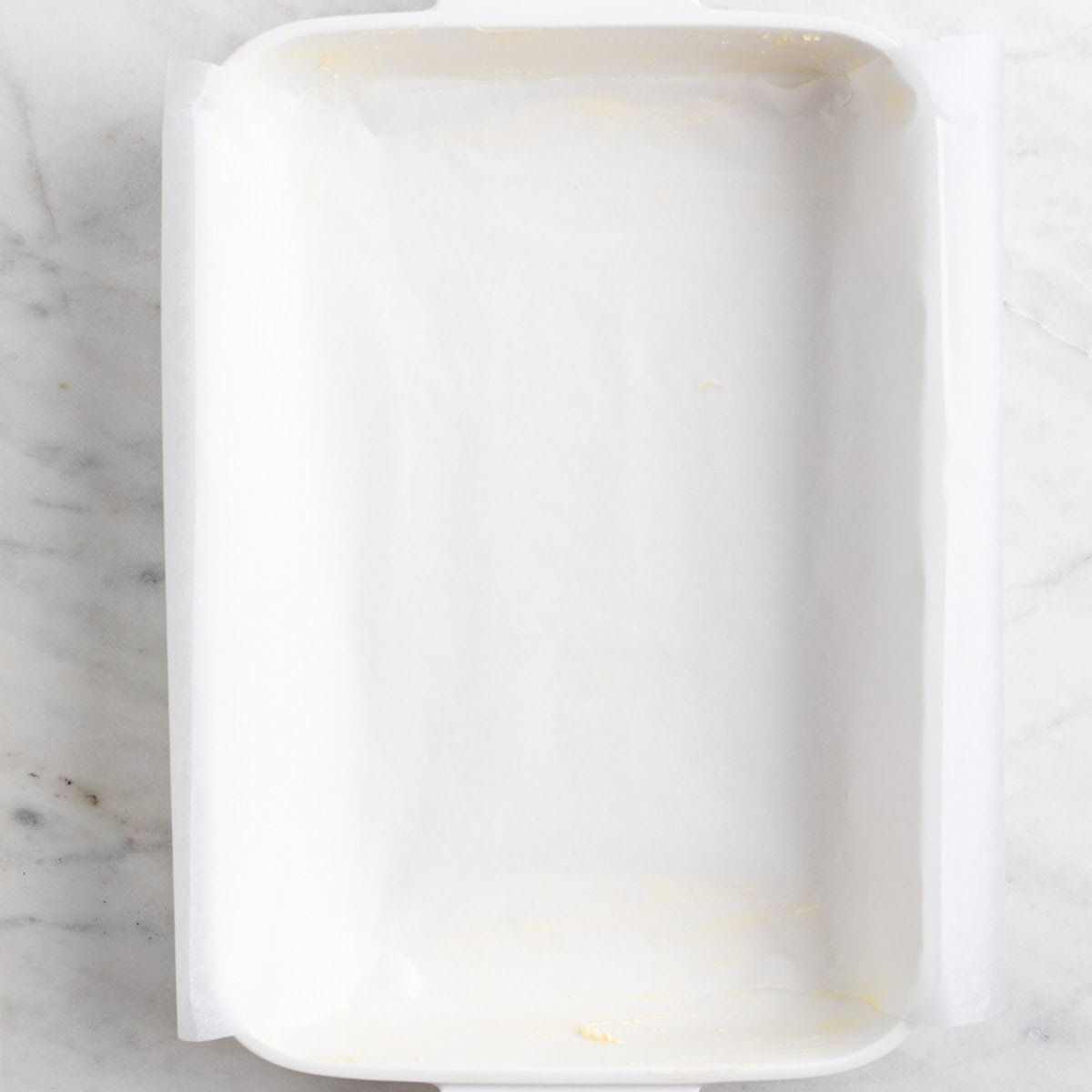 Baking dish lined with parchment paper.