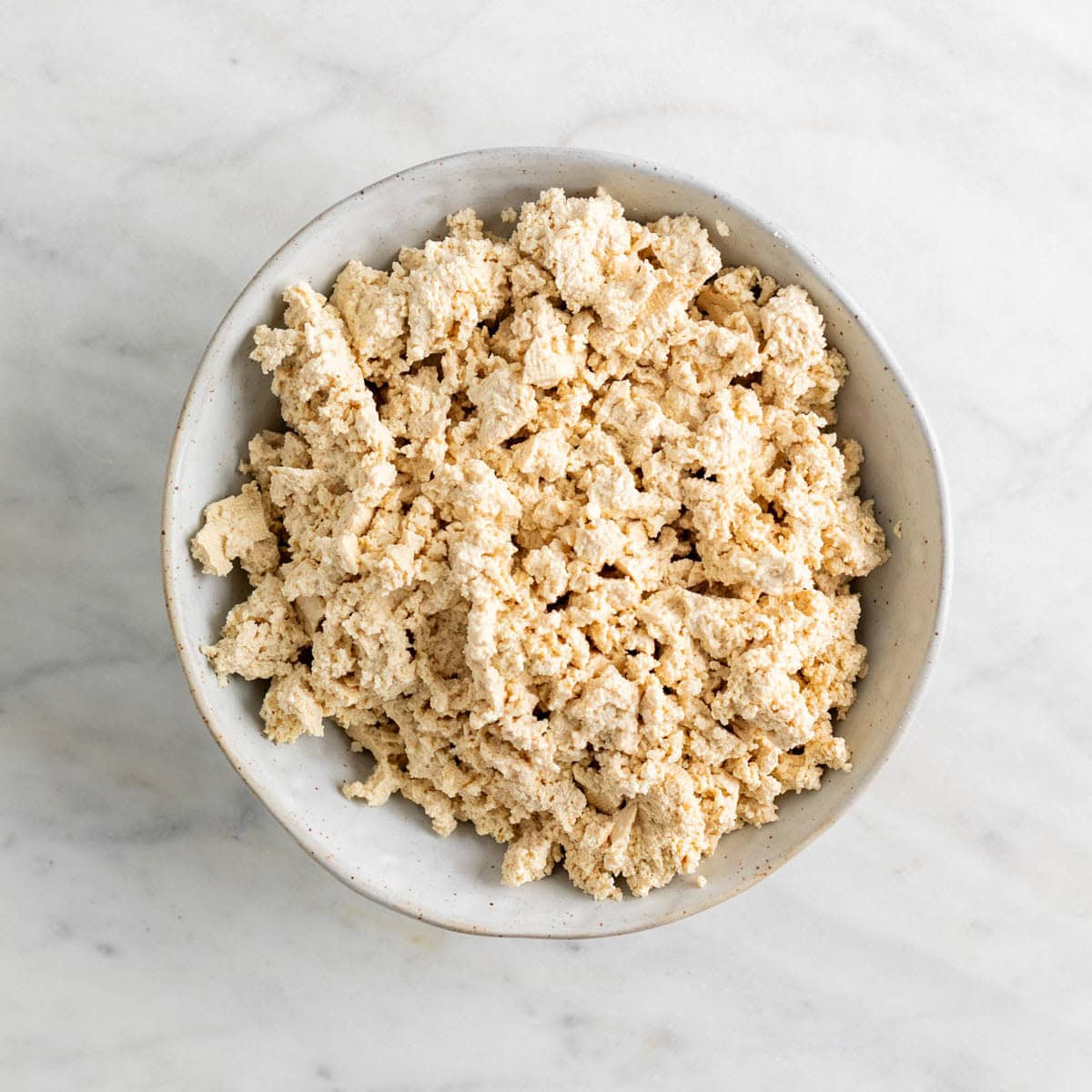Crumbled tofu in a bowl.