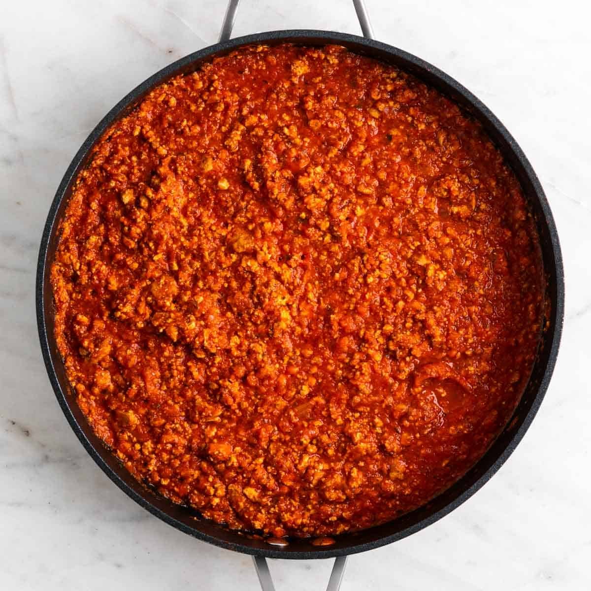 Tofu bolognese sauce in a skillet.