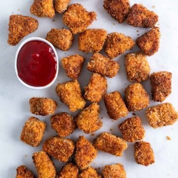 Tofu chicken nuggets served with ketchup.