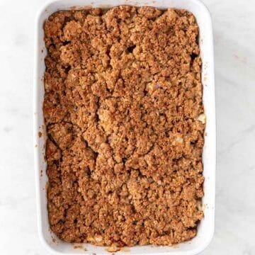 Baking dish with vegan apple crisp after baking.