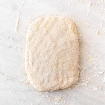 Biscuit dough ready for cutting after final folding and flattening.