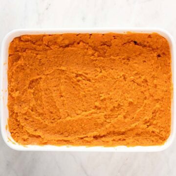 Vegan sweet potato casserole filling in a baking dish.