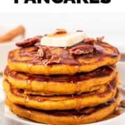 Pancakes with fall toppings and a text overlay that says “Vegan Pumpkin Pancakes”