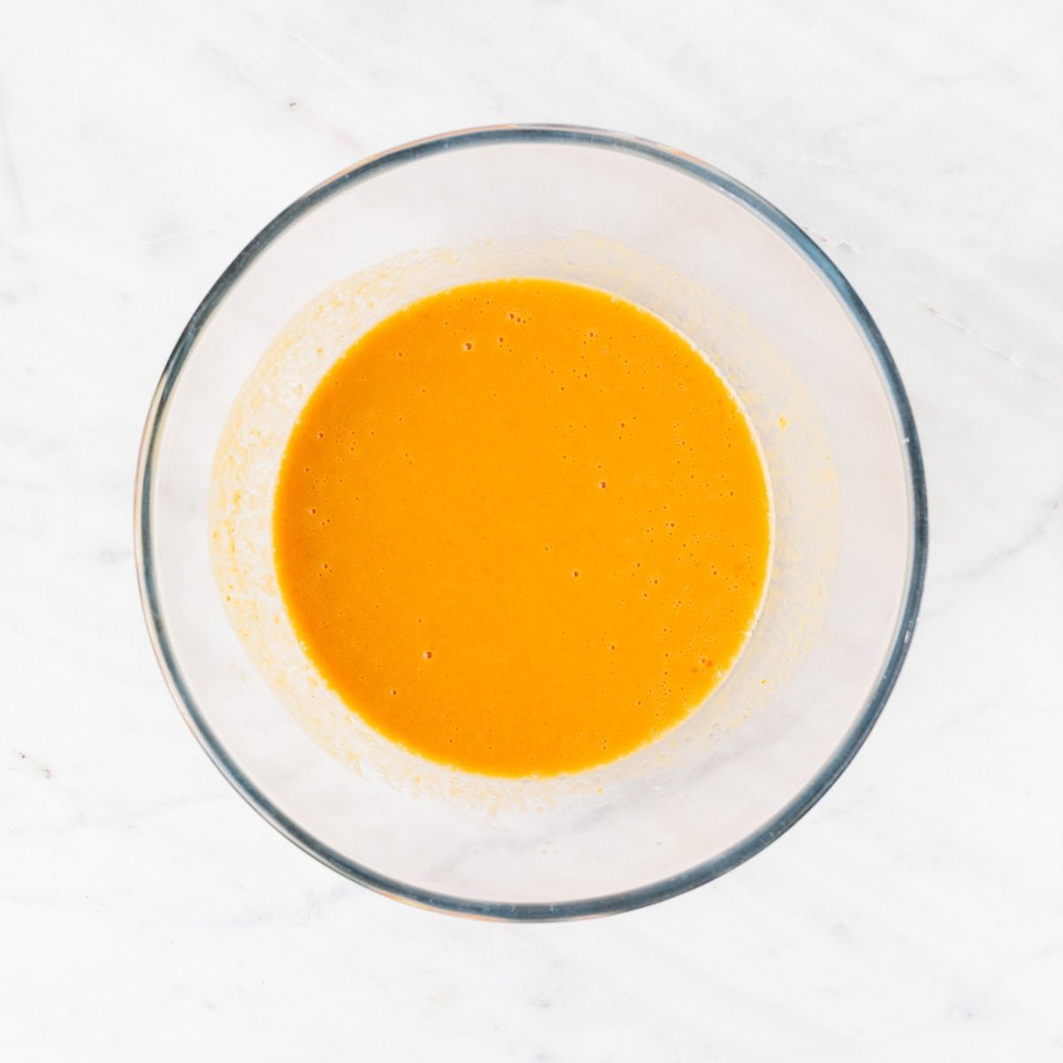 Wet ingredients mixed in a large bowl.