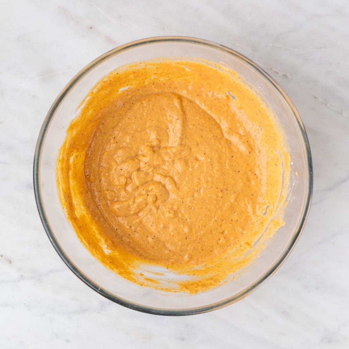 Vegan pumpkin pancakes batter in a large bowl.