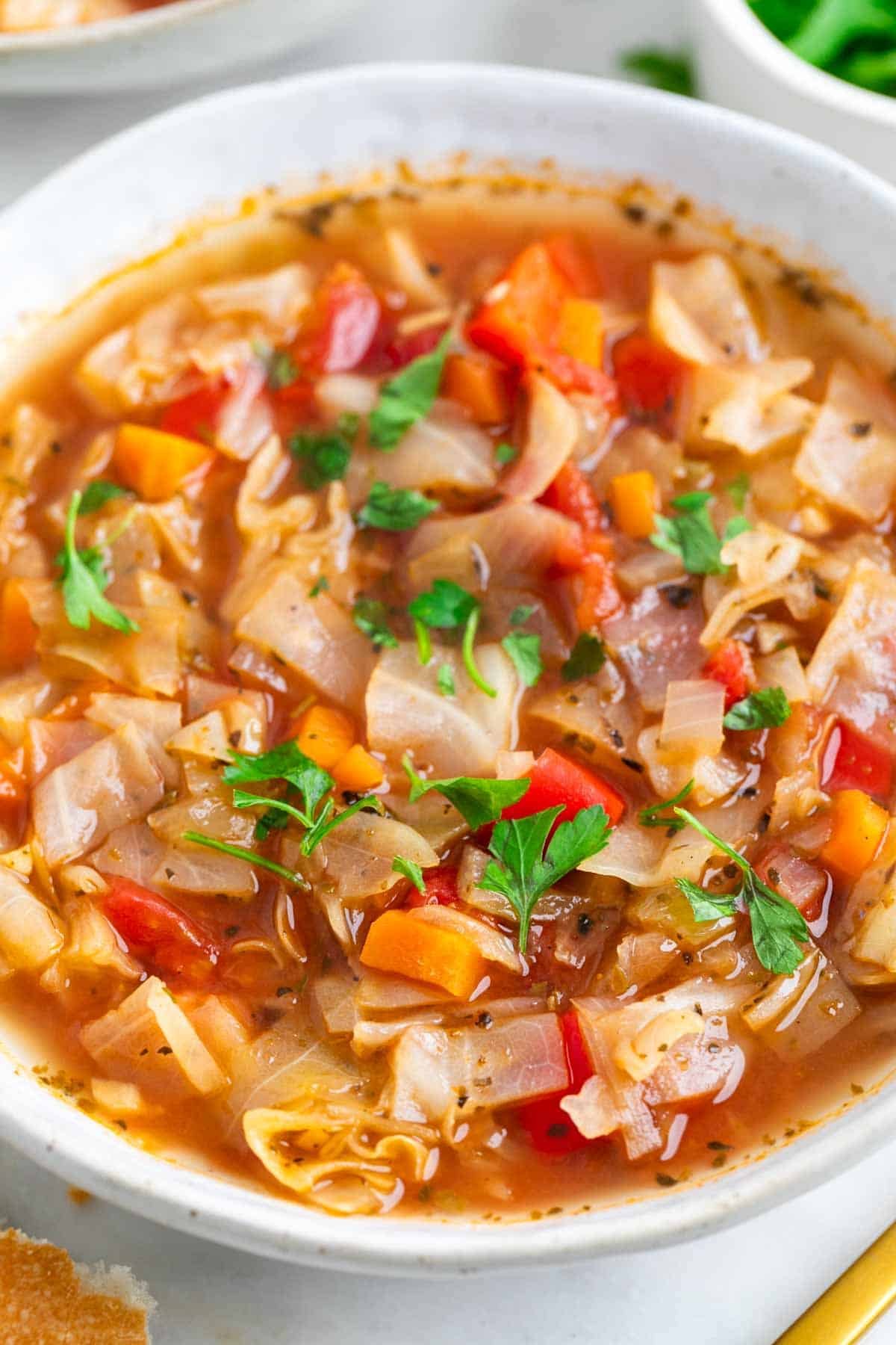 Cooked vegan cabbage soup in a pot.