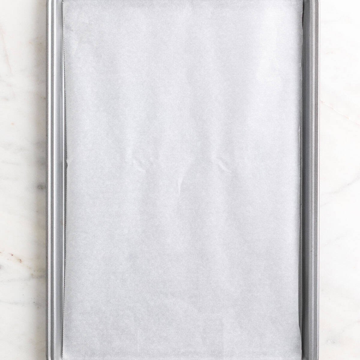 Baking sheet lined with parchment paper.