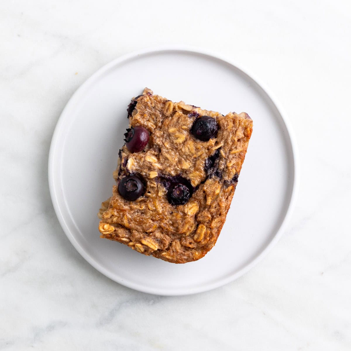 Slice of vegan baked oatmeal served on a plate.