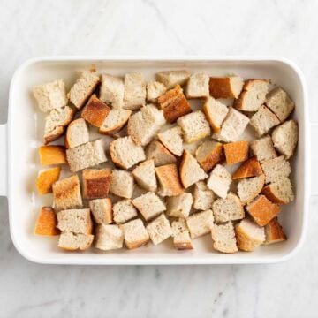Crusty bread pieces in a baking dish.