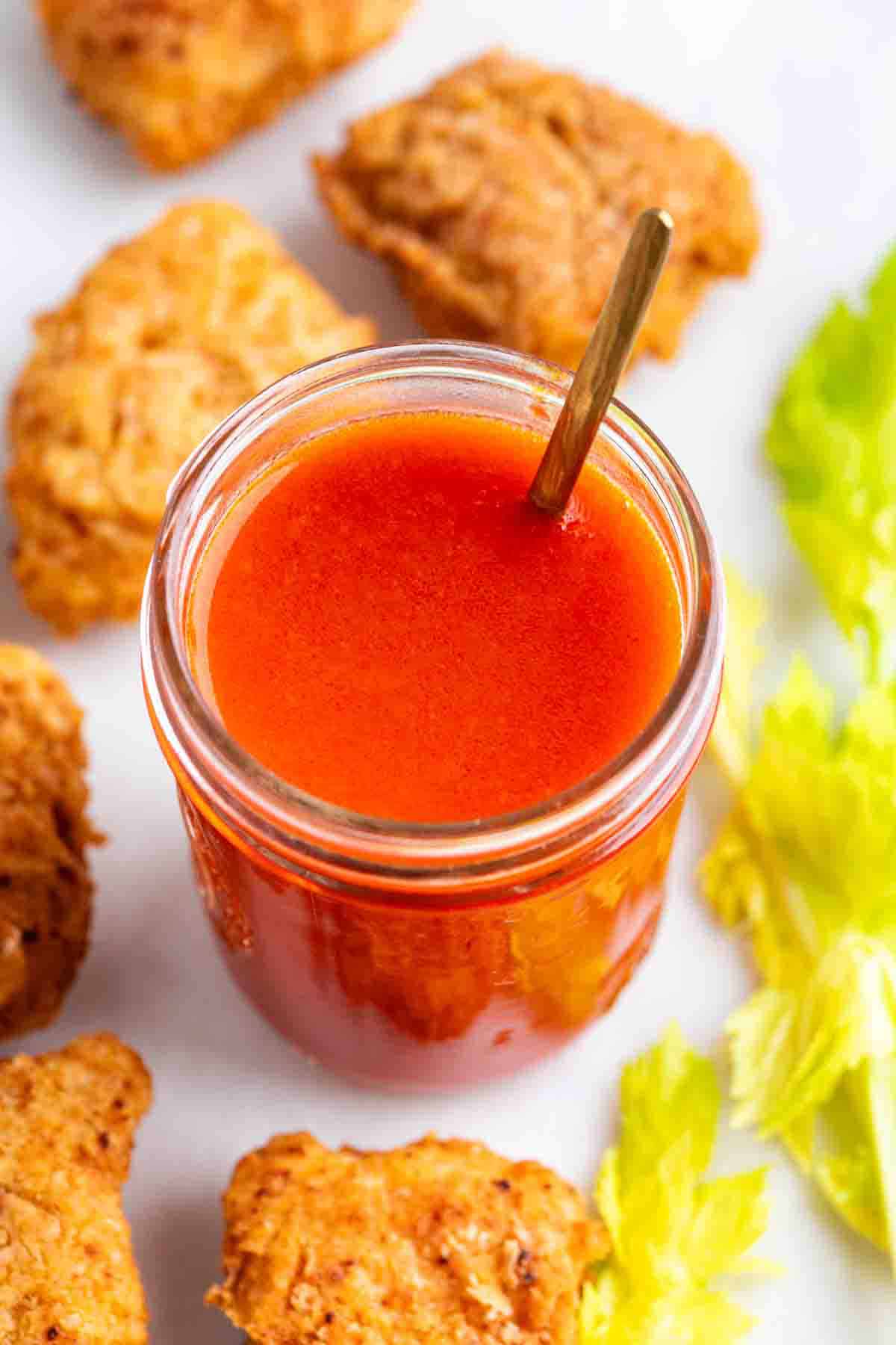 Vegan buffalo sauce in a jar.