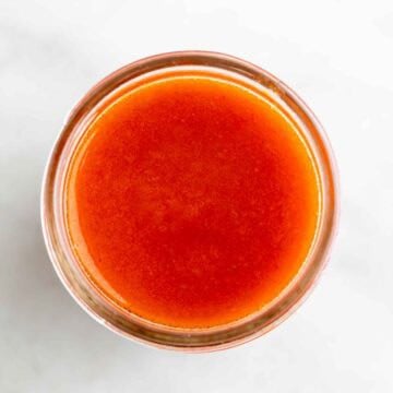Vegan buffalo sauce in a jar.