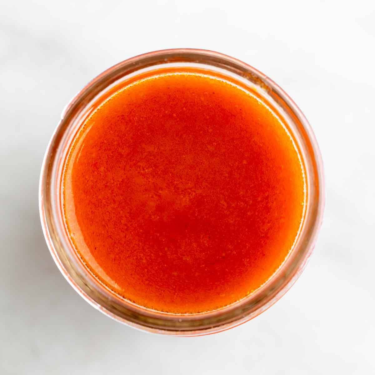 Vegan buffalo sauce in a jar.