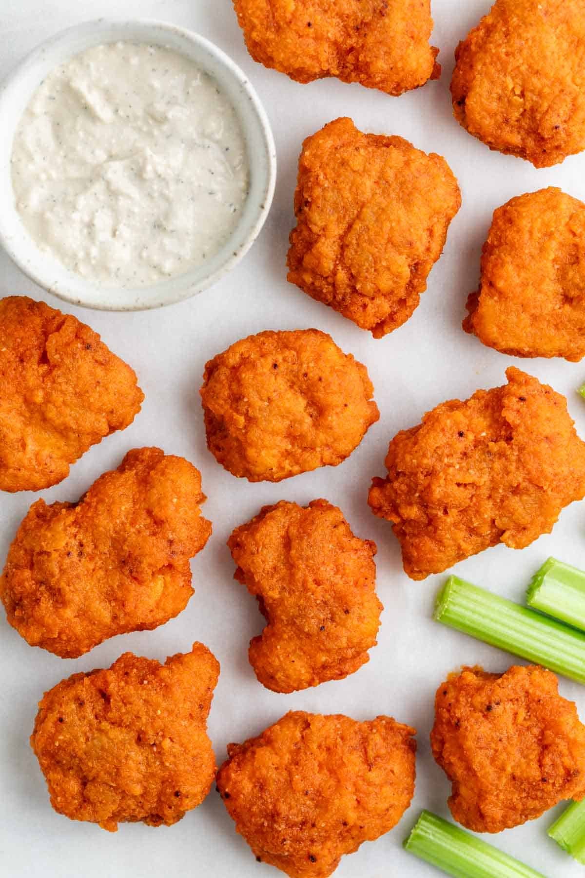 Vegan buffalo wings served with vegan blue cheese dressing and celery.