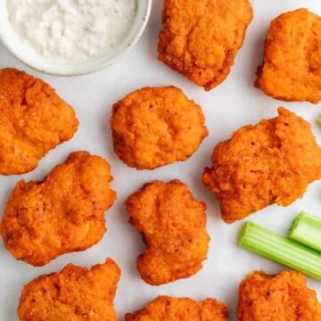 Vegan buffalo tofu wings with blue cheese dressing and celery.