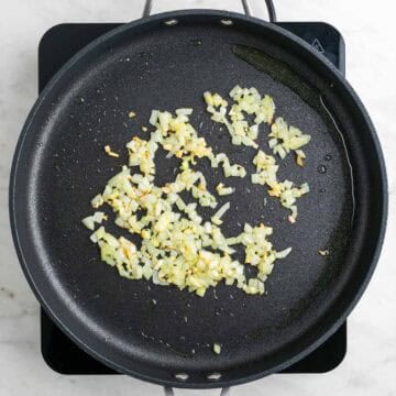 Sautéed garlic and onion in a skillet.