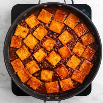 Cooked spicy tofu in a skillet.