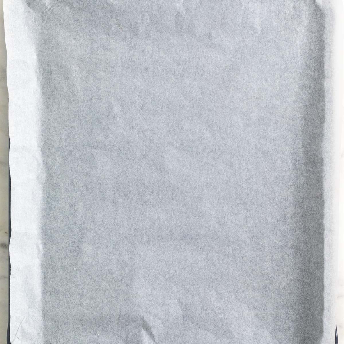 A baking sheet lined with parchment paper.