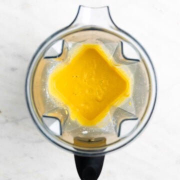 Vegan cheddar cheese mixture in a blender before cooking.