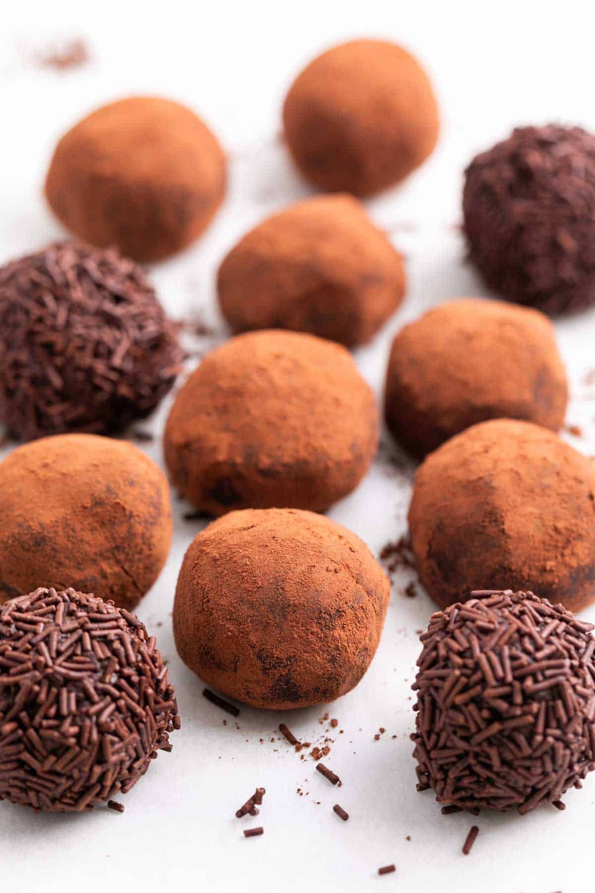 Finished vegan chocolate truffles with cocoa powder and chocolate sprinkles.