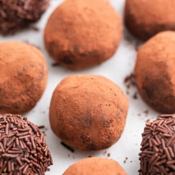 Vegan chocolate truffles with different toppings.