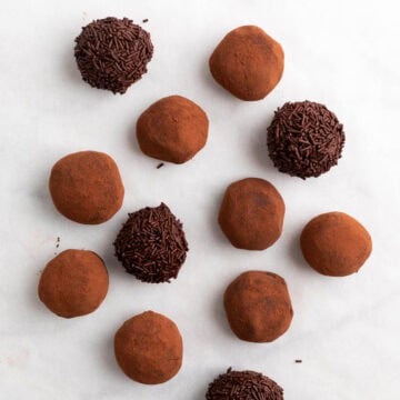 Finished vegan chocolate truffles on parchment paper.