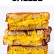Vegan grilled cheese sandwich cut into halves and stacked.