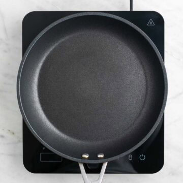 Skillet heating on the stove.