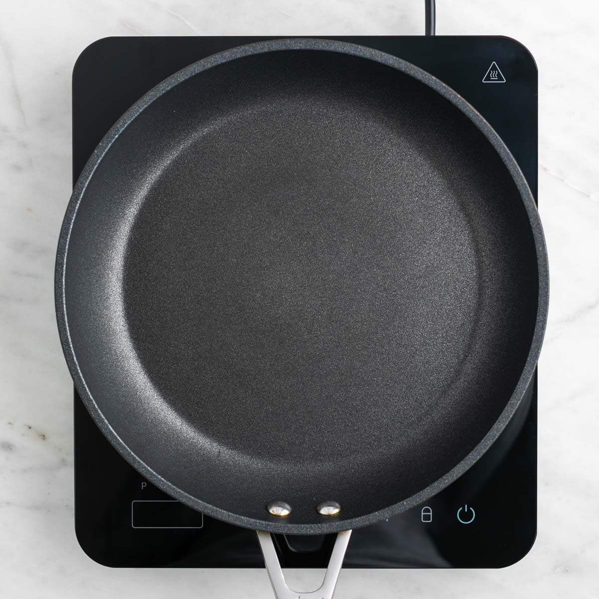 Skillet heating on the stove.